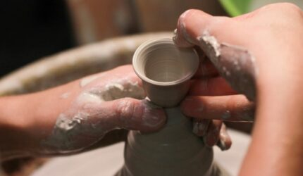 Potter's wheel, hands working with clay at art fair in Richardson 