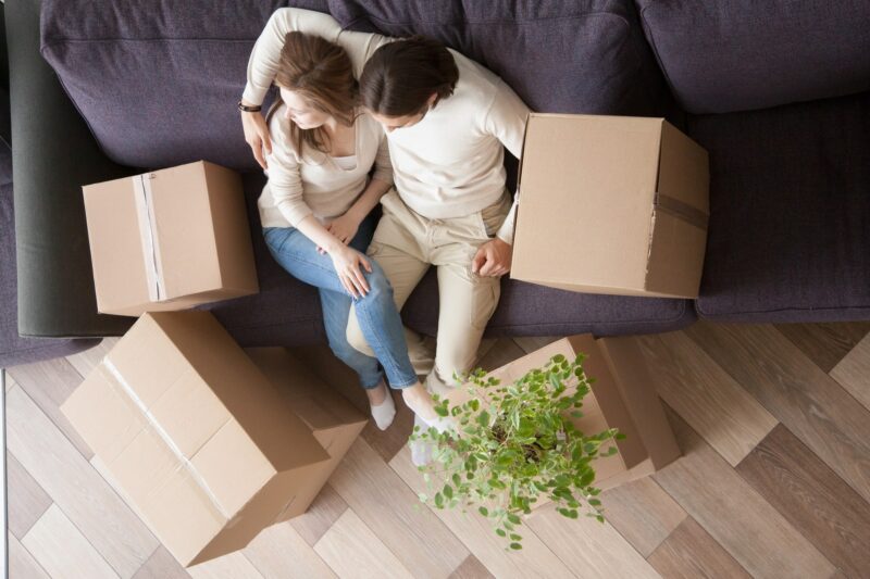 Newlyweds buying a home and moving boxes