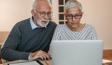 Couple looking at finances planning to move to a New Pad for Fall